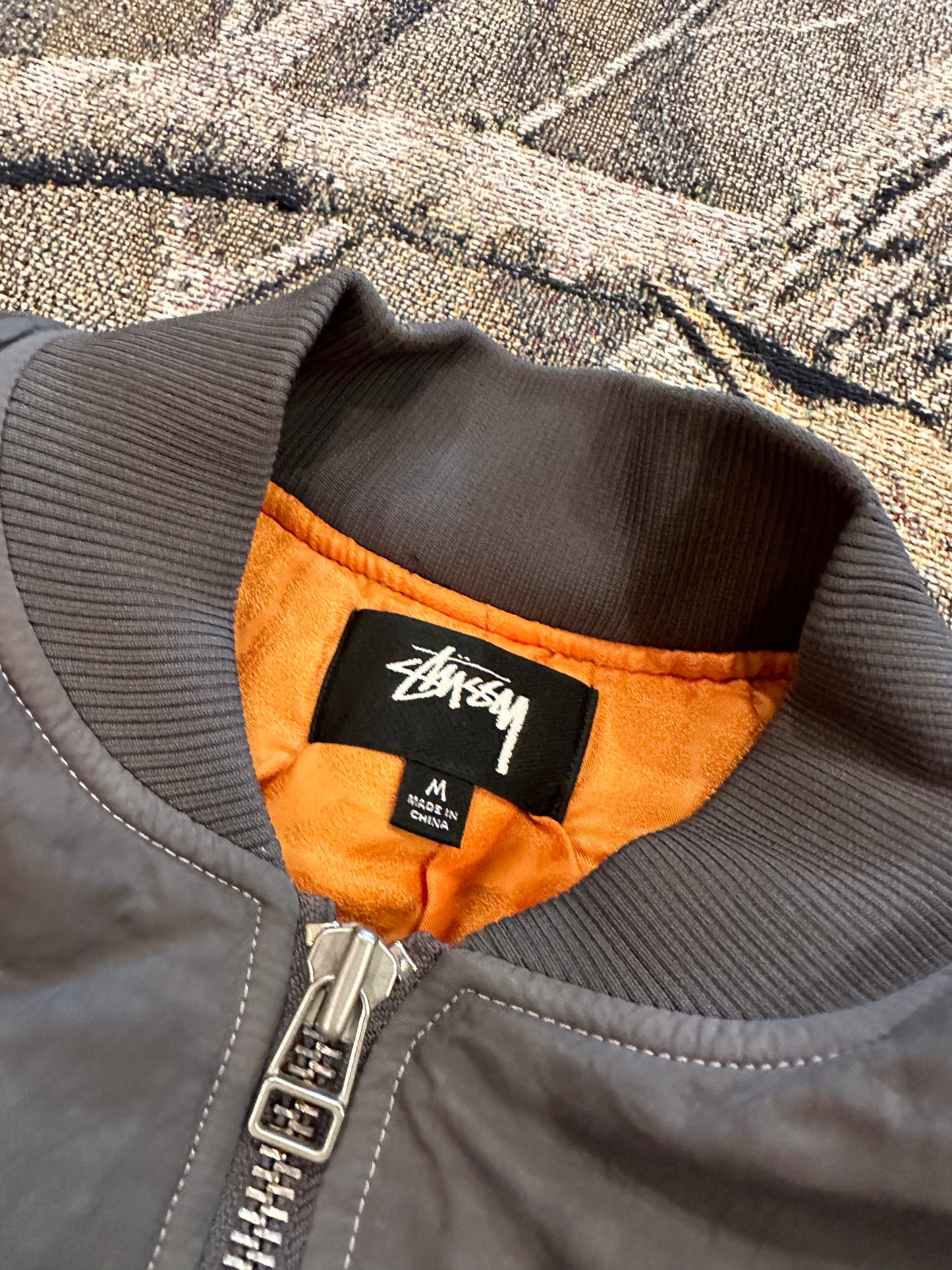 (M) Stussy dyed nylon bomber jacket